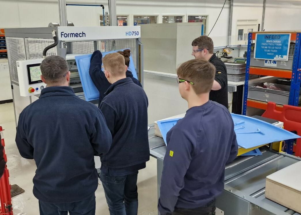 Training Eaton staff members on the Formech HD750 vacuum forming machine