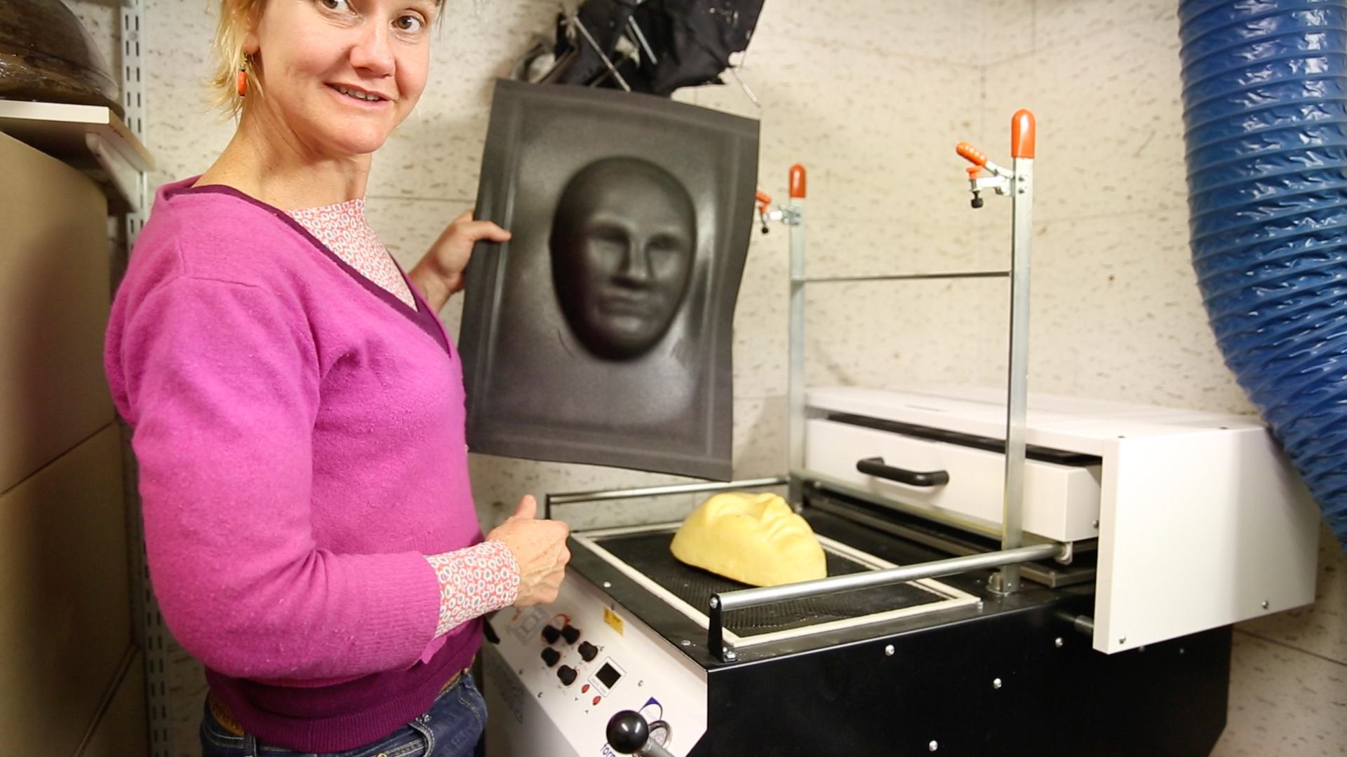 Megan Bearup, Head Milliner of ENO, with a vacuum formed face mask